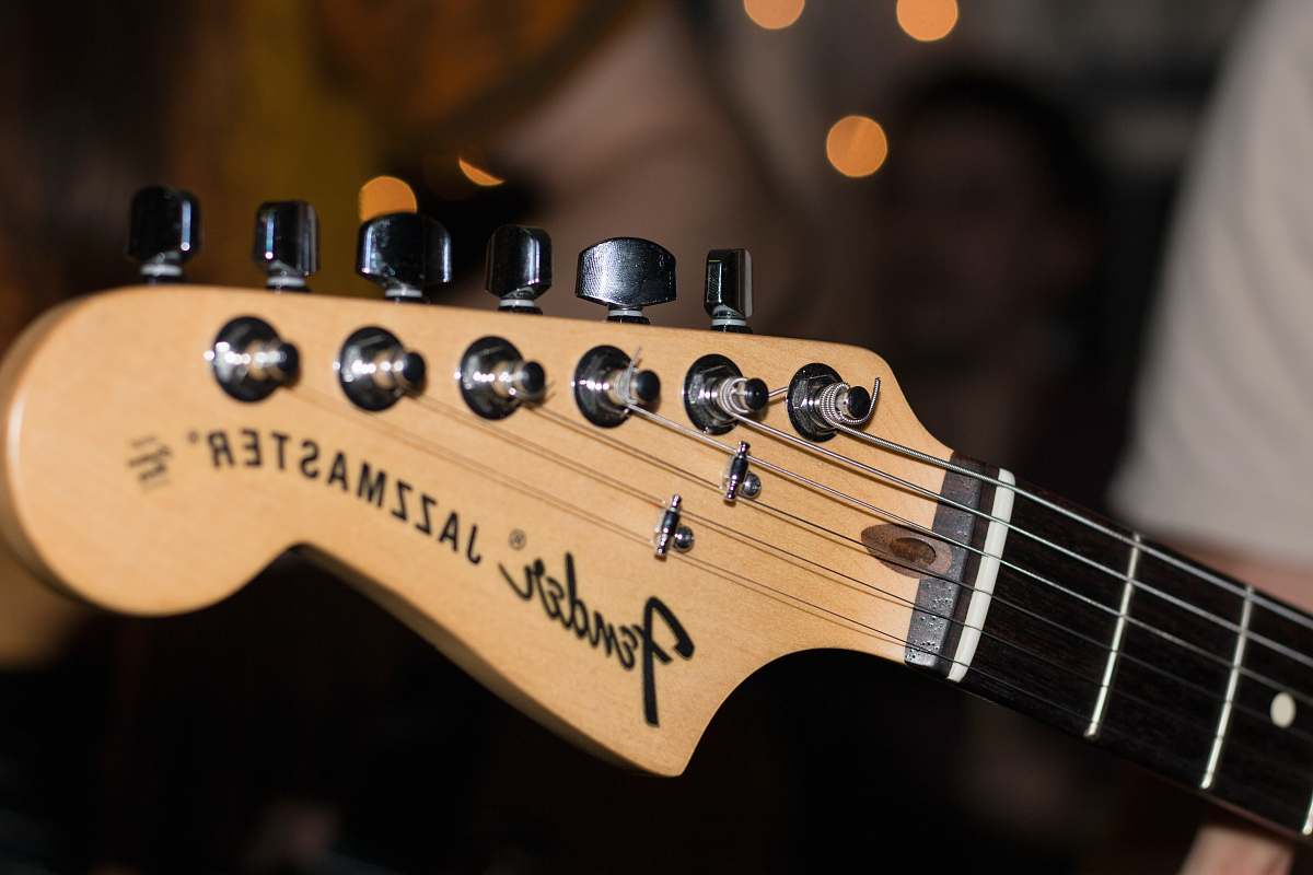 electric guitar photo of brown Fender Jazzmaster guitar headstock guitar